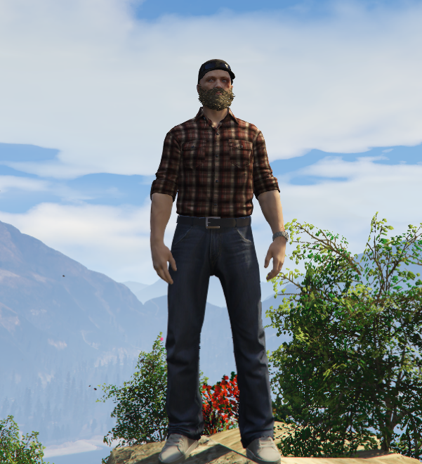 Matthias Mittermayr als In-Game-Charakter in kariertem Hemd vor Bergkulisse